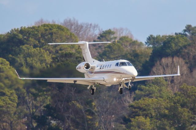 Embraer Phenom 300 (N407QS) - N407QS a 2017 Embraer Phenom 300 was on final at Atlanta's PDK executive airport. I shot this with my Canon 800mm lens. Camera setting were 1/5000 shutter, F5.6, ISO 1000. POSITIVE VOTES AND POSITIVE COMMENTS ARE ALWAYS APPRECIATED. PLEASE CHECK OUT MY OTHER AIRCRAFT PHOTOGRAPHY. Questions about this photo can be sent to Info@FlewShots.com