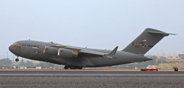 Boeing Globemaster III (04-4132) - Loaded with the last of the presidential motorcade vehicles and some other presidential protection equipment items utilized during Trump's visit to northern Nevada, this Boeing C-17A Globemaster (044132) rotates away from Runway 16R.