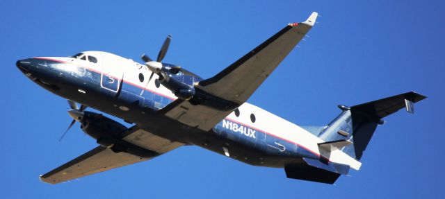 Beechcraft 1900 (N184UX) - Departing runway 25.