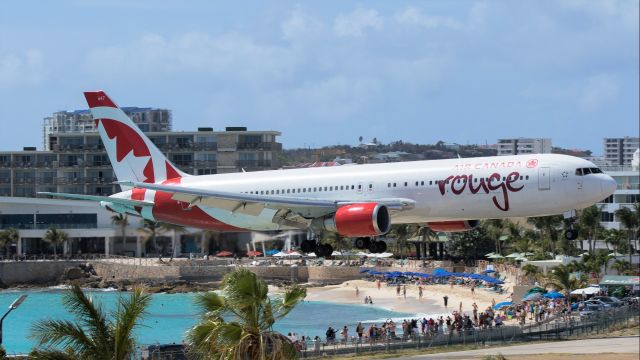 BOEING 767-300 (C-GEOQ) - Air Canada Rouge B767 over the Maho beach for landing!br /Thank you pilot the tower said it was a very good landing and wish all the heavies could land like you.