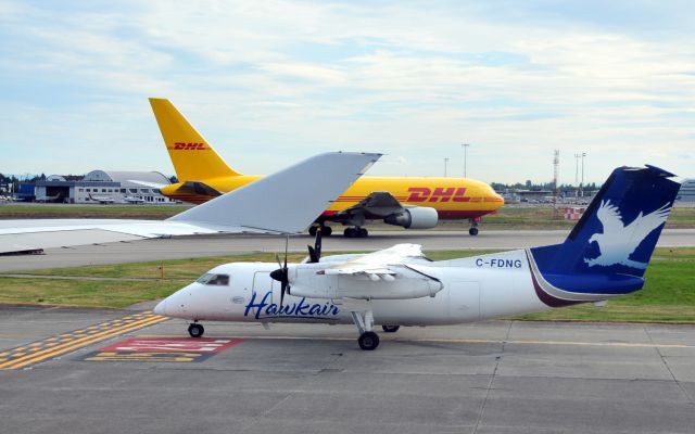 de Havilland Dash 8-100 (C-FDNG) - Waiting on the flight line...  Traffic congestion :-)