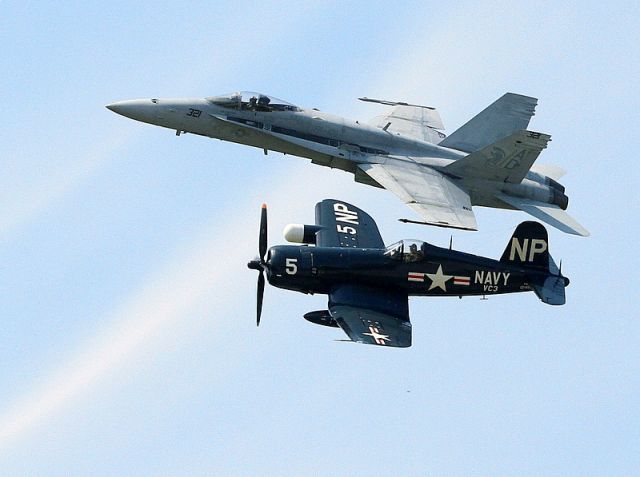 VOUGHT-SIKORSKY V-166 Corsair (NX45NL) - Vought  F4U-5NL Corsair and F/A-18 Hornet..Photo taken from the ground.  This is a real photo.  Nothing was photoshoped into the image.