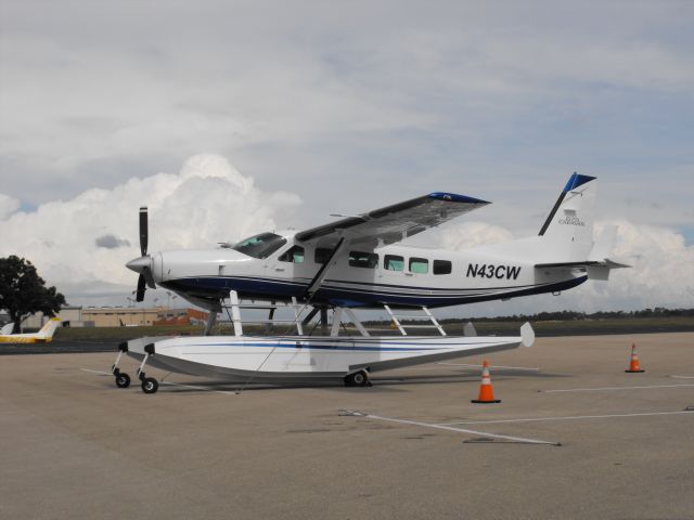 Cessna Caravan (N43CW) - Caravan on floats looking good on the ramp with building storms to the east.