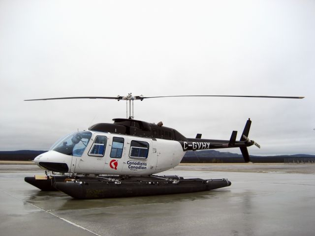 Bell JetRanger (C-GVHX) - C-GVHX, Canadian Helicopters Bell 206 on floats waiting for fuel on a cold and windy day - May 2011, parked at Némiscau (CYHH).