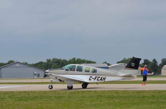 Beechcraft Bonanza (36) (C-FCAH) - Bonanza mass arrival at AirVenture 2014