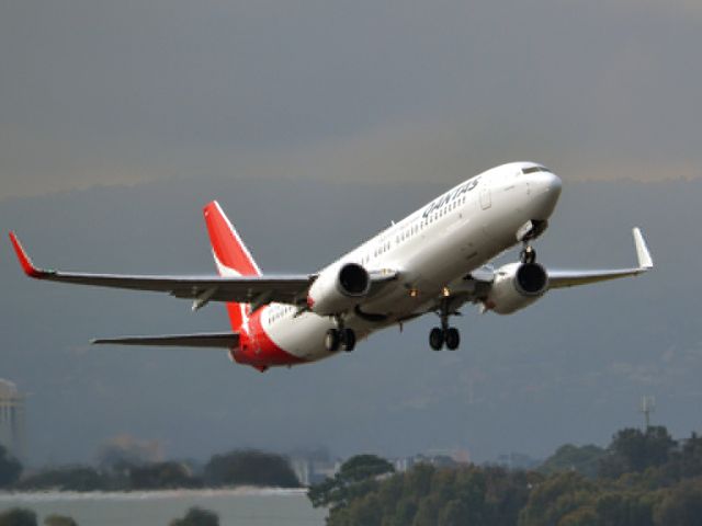 Boeing 737-800 (VH-VXD) - Getting airborne off runway 23 on a gloomy, cold winters day. Wednesday 4th July 2012.