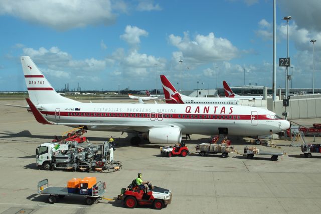 Boeing 737-700 (VH-VXQ) - Qantas Retro-Roo ready to go.  Painted in the livery used on Qantas Boeing 707 jets from 1959 to 1961, when Qantas became the worlds first airline to offer a round-the-world service with the jet.  Taken from the departure lounge corridor in Brisbane domestic terminal.  22nd Feb 2015  4:26 pm