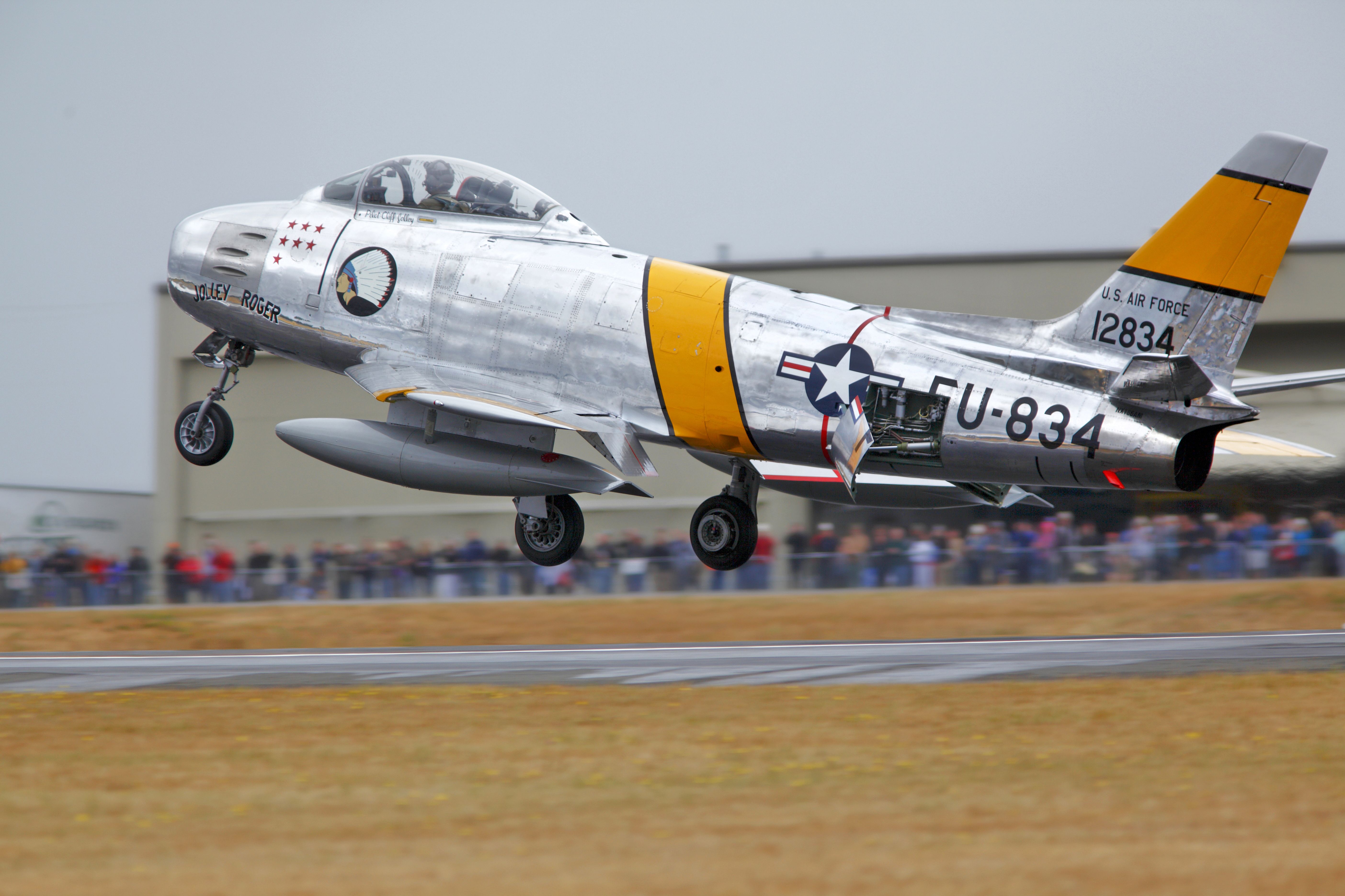 — — - Planes of Fame F-86F just before touchdown at Paine Field, Everett Wa.