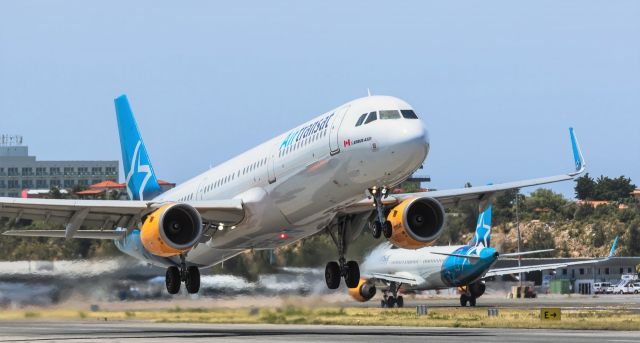 Airbus A321 (C-GEZX) - AirTransat Airbus A321 C-GEZX rotating while sister ship C-GTCY taxi's for parking.br /Be safe and see you guys soon again was the last words from the ATC on there last flight out of St Maarten for awhile!br /21-03-2020