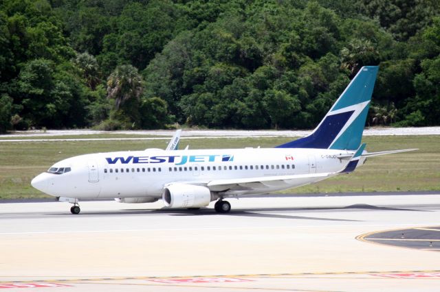 Boeing 737-700 (C-GWJO) - West Jet Flight 1245 (C-GWJO) departs Tampa International Airport enroute to Toronto Pearson International Airport