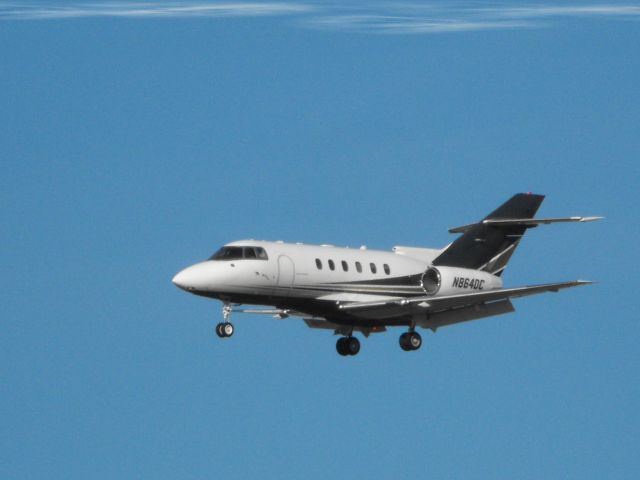 Hawker 800 (N864DC) - A moment or two from landing shown here is this small Hawker business Jet in the Winter of 2014.