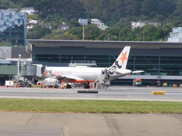 VH-VQA — - Jetstar A320-232 parked at Wellington Airport captured at Wellington from outside the Spruce Goose cafe
