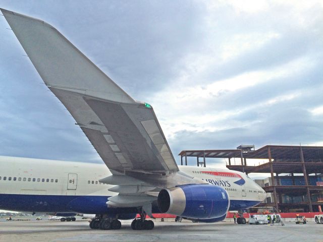 Boeing 747-400 (G-BYGD) - 04/26/2016 Speedbird with Terminal E KBOS Logan modernization project in progress