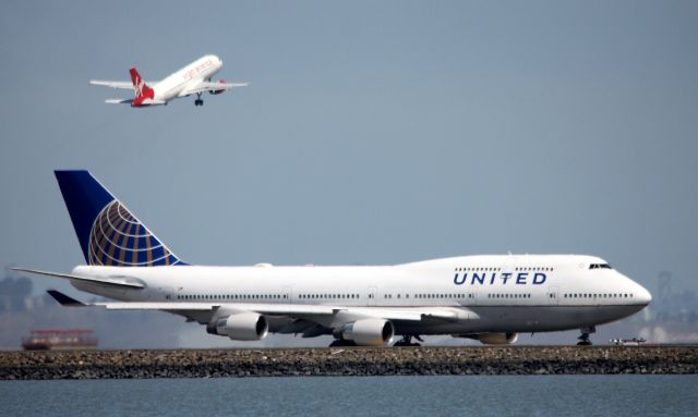 Boeing 747-400 (N119UA) - Virgin America departure from 1R as UAL taxiing to 28L, No flight information located