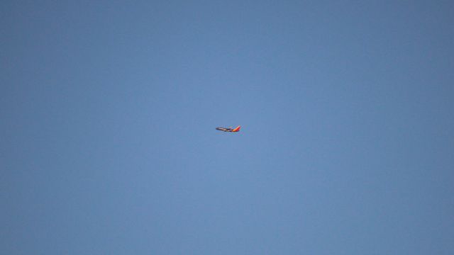 Boeing 737-800 — - A departure from Love Field as seen from Founder's Plaza at DFW on a remarkably clear evening.