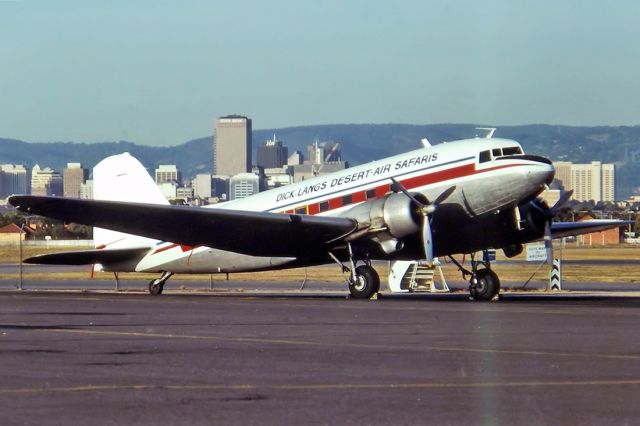 VH-BPN — - DICK LANGS DESERT-AIR SAFARIS - DOUGLAS C-47B SKYTRAIN (DC-3 - REG : VH-BPN (CN 16197/32945)) - WEST BEACH ADELAIDE SA. AUSTRALIA - YPAD (1/5/1993) 35MM SLIDE CONVERSION USING A LIGHTBOX AND A NIKON L810 DIGITAL CAMERA IN THE MACRO MODE.
