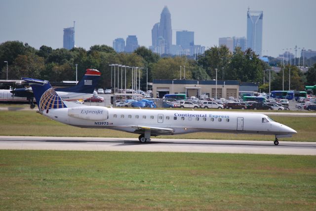 Embraer ERJ-145 (N13975) - Rolling down runway 18C - 10/4/09