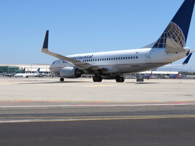 Boeing 737-700 (N16703) - Holding short of RWY 19R