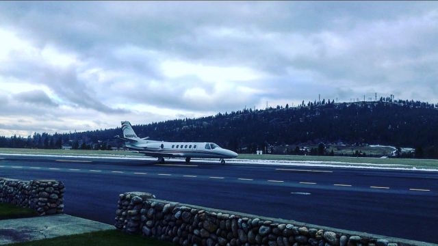 Cessna Citation II (N888RL) - Standing right outside door that leads to taxiway when N888RL landed and taxied directly past me. Extremely loud, but I managed to get this picture with perfect lighting.