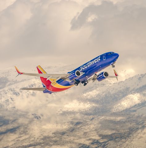 Boeing 737-800 (N8643A) - SLC Southwest departure with a mountainous background taken from a nearby warehouse