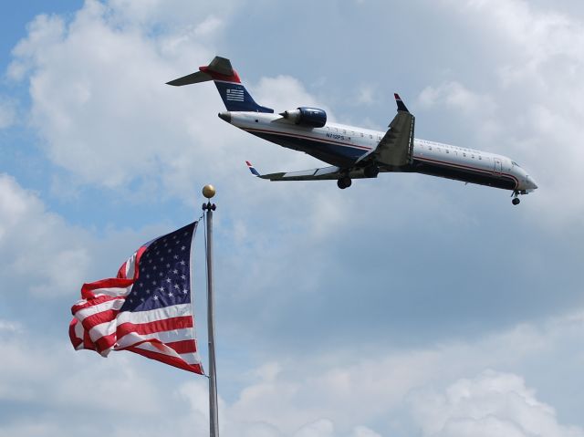 Canadair Regional Jet CRJ-700 (N712PS) - Final for runway 23 - 6/25/13