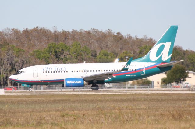 Boeing 737-700 (N240AT) - AirTran Flight 214 (N240AT) prepares for departure from Southwest Florida International Airport enroute to Baltimore/Washington International Airport