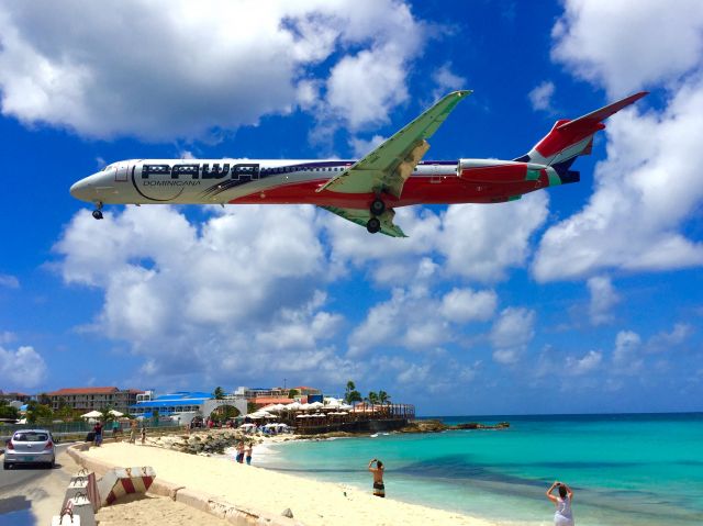 McDonnell Douglas MD-83 (HI990) - Classic Maddog posing for early morning beach goers over everfamous Maho Beach, St. Maarten. 