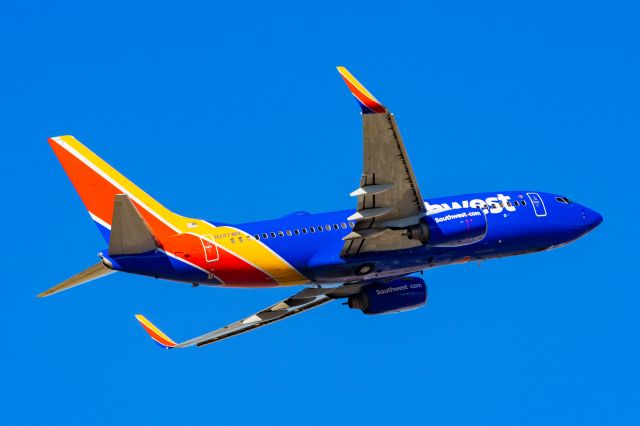 Boeing 737-700 (N247WN) - Southwest Airlines 737-700 taking off from PHX on 11/12/22. Taken with a Canon R7 and Tamron 70-200 G2 lens.