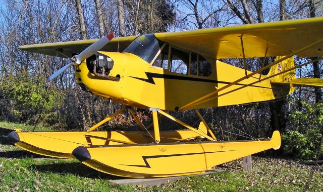 Piper NE Cub — - Just one of the planes at Surfside Seaplane Base in the late fall in Minnesota. Sorry I don't have the full N number. 