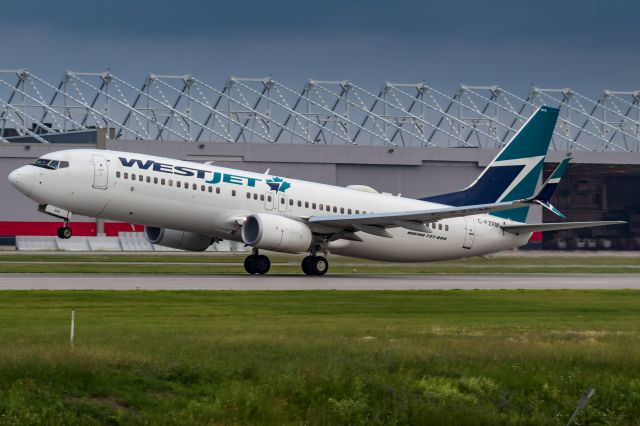 Boeing 737-800 (C-FZRM) - WestJet 215 blasts out of Montreal Trudeau Airport for a flight to Calgary.