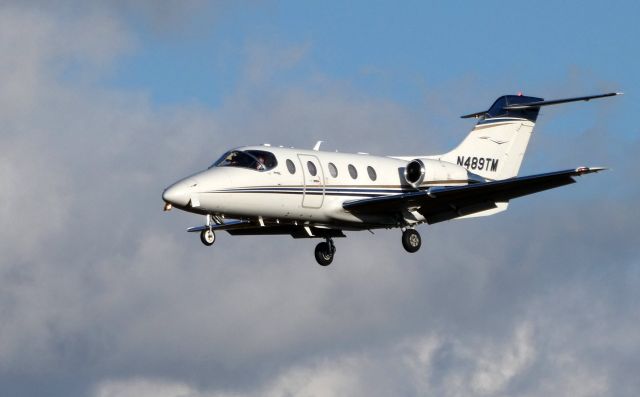 Beechcraft Beechjet (N489TM) - On final is this 2008 Raytheon Hawker Beechjet 400A in the Autumn of 2019.