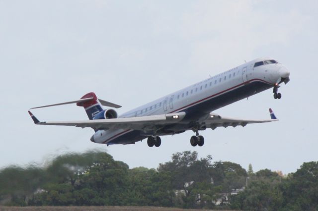 Canadair Regional Jet CRJ-900 (N921FJ) - Mesa Airlines/US Airways Express Flight 2647 (N921FJ) departs Runway 14 at Sarasota-Bradenton International Airport enroute to Charlotte/Douglas International Airport