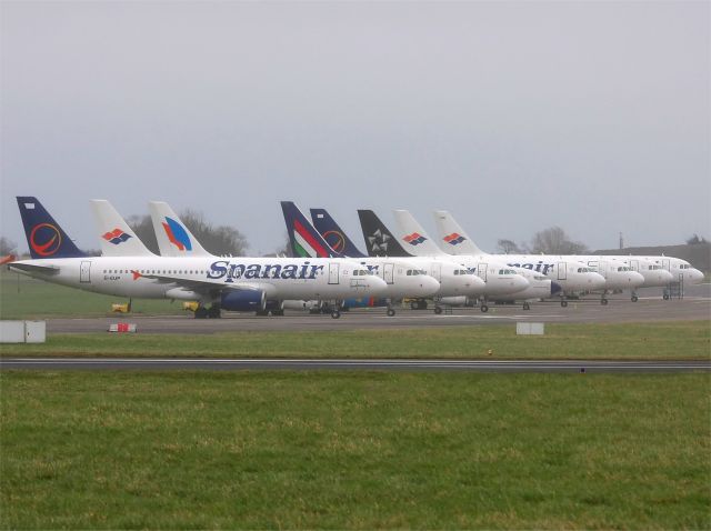 Airbus A320 (EI-EUP) - With the demise of Spanish carrier "Spanair" recently, a number of their aircraft have been ferried to Dublin for storage.br /br /The current state of the aviation industry is portrayed by this image, included are aircraft of  Spanair from Spain, Malev from Hungary and HellasJet from Greece