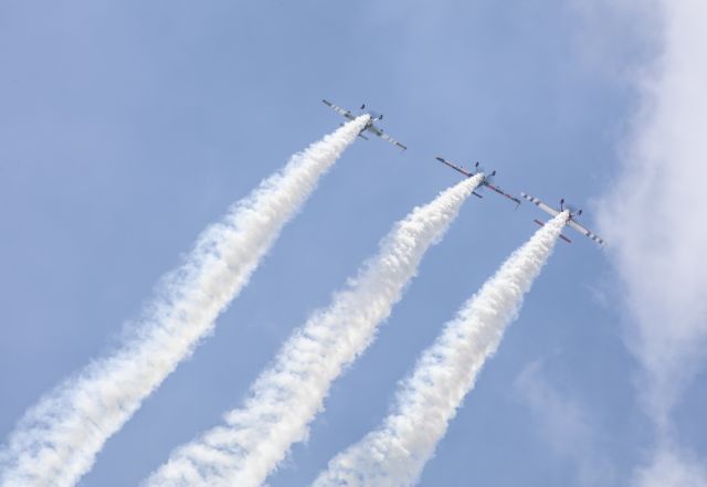 EXTRA EA-300 (N540JH) - Rob Holland, Bill Stein, and Jack Knutson of the Firebirds Xtreme team perform their aerobatic act at Battle Creek Airshow in 2017.