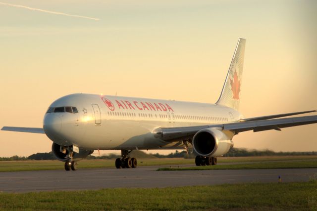 BOEING 767-300 (C-GLCA) - Taxiing to Rwy 25 at sunset for a non-stop service to Frankfurt.