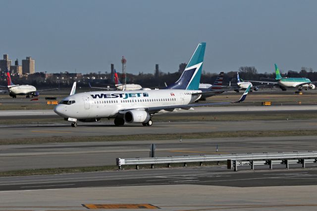 Boeing 737-700 (C-GWJG) - WJA1681 to Calgary joining the queue for the 6pm rush hour at JFK