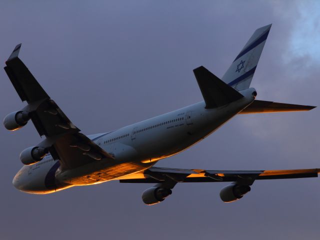 Boeing 747-200 — - Israeli EL-AL B747-400 departs LHR's runway 027R at sunset.