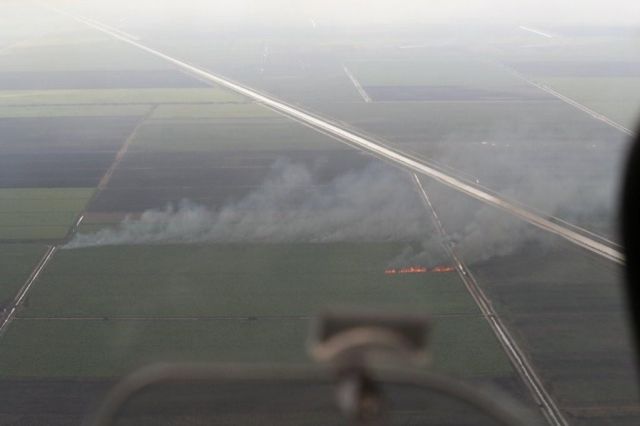 Diamond Star (N867DS) - Suguar field control burn so. central FL