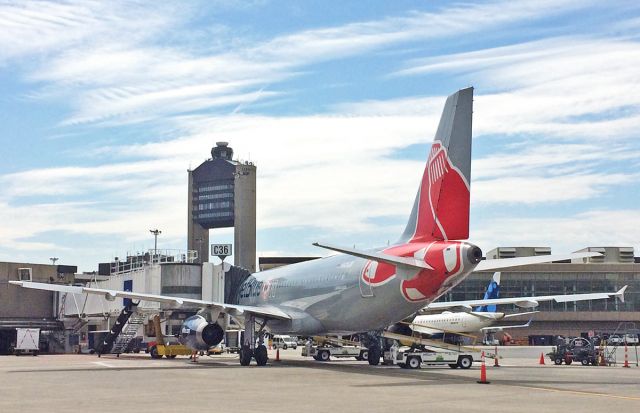 Airbus A320 (N605JB) - JetBlue A320 Red Sox special livery with KBOS Logan ATC Tower 