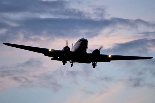 Douglas DC-3 (N705GB) - 4/11/13:  Atlantic Air Cargo Inc. DC-3 on short final approach over Miami Lakes after sunset enroute to runway 9-left at Opa-locka Executive Airport.