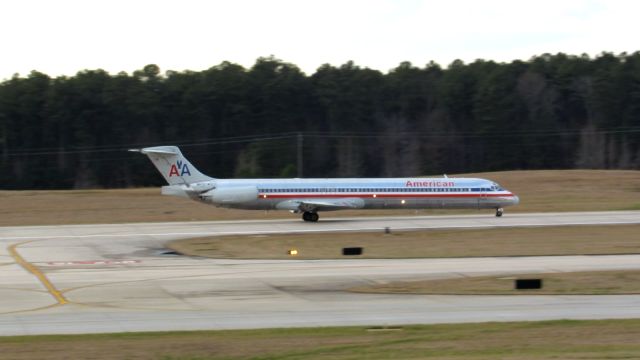 McDonnell Douglas MD-83 (N972TW) - An American Airlines McDonnell Douglas MD-80 landing at Raleigh-Durham Intl. Airport. This was taken from the observation deck on January 17, 2016 at 4:40 PM. This is flight 1348 from DFW.