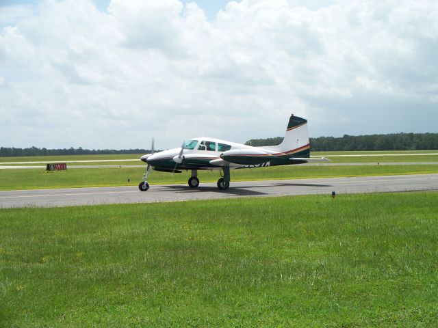 Cessna 310 (N5267A) - Taxiing down alpha, heading to 14 for takeoff at Lone Star.  Beautiful aircraft!