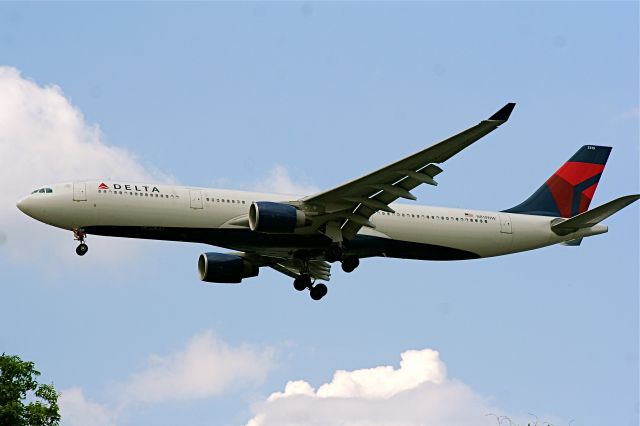 Airbus A330-300 (N819NW) - seconds away from touchdown from Paris Charles DeGaulle.
