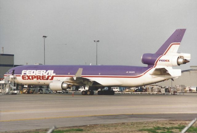 Boeing MD-11 (N602FE) - early 90's. Scanned from a print.