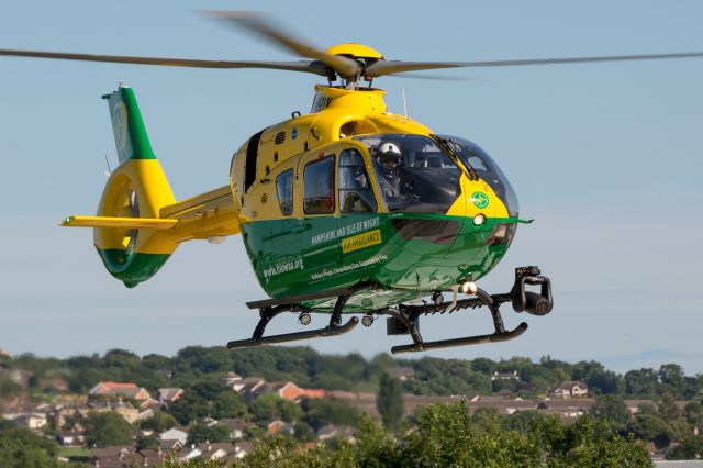 Eurocopter EC-635 (G-HIOW) - Hampshire & Isle of Wight Air Ambulance landing at St.Mary’s Hospital landing pad at Newport on the Isle of Wight