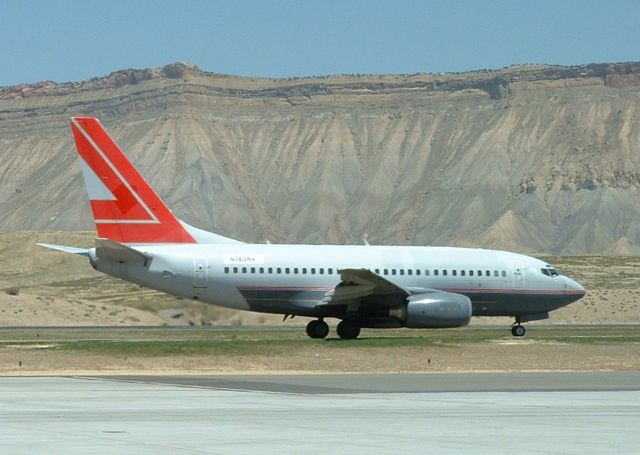 BOEING 737-600 (N743NV) - 15 MAY 2009 - At the time of this photo this aircraft was in use by the US Navy as an E-6B trainer.  Seen here working the pattern at KGJT.