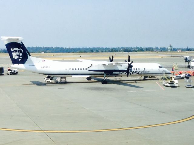 de Havilland Dash 8-400 (N438QX) - This picture was took at Seattle-Tacoma Intl. I was right inside the main concourse looking at the c-branch gates where this q400 was at.