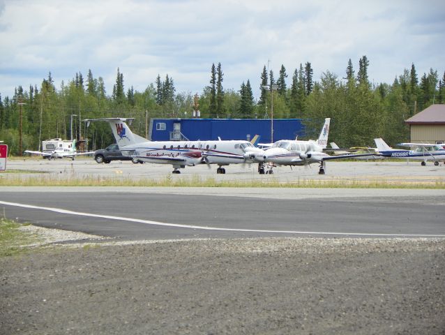 — — - Afternoon rush. Navajo holding short of active and the 1900 in back doing engine/prop run ups