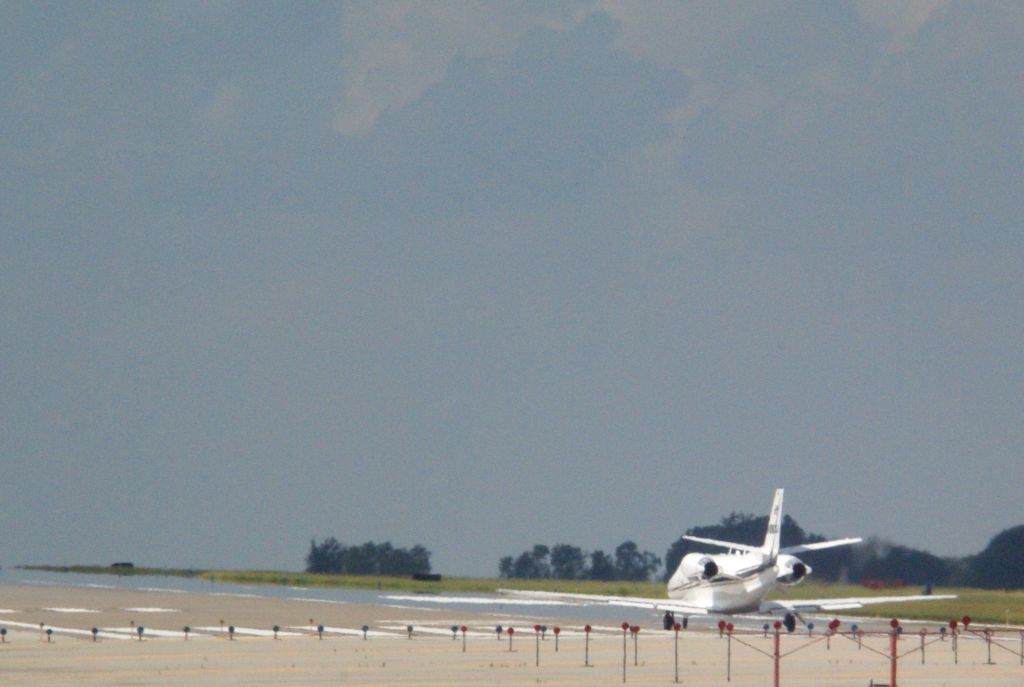 Cessna Citation Excel/XLS — - Jetlink 106 lines up to take off for Dulles.
