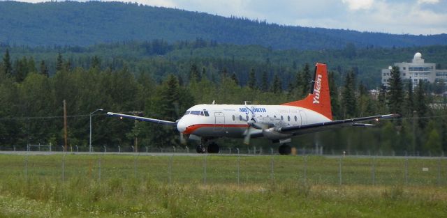 — — - Once weekly flight from Whitehorse. Hawker Siddley 748 building up speed